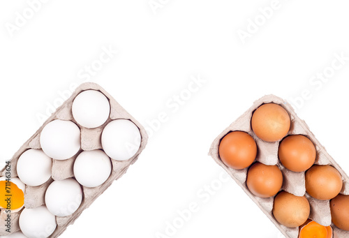 Many eggs lie on the background of hay, top view.