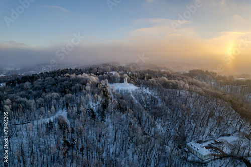 Aerial beautiful winter snowy sunrise view of Vilnius old town, Three Crosses Monument (Trys kryžiai), Lithuania