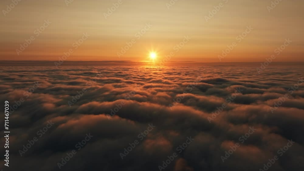 Aerial drone view above atmospheric clouds at sunset, horizon view at dawn Aerial drone view above atmospheric clouds at sunset, horizon view at dawn