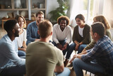 Multiethnic young people sitting in circle participating in group psychological therapy together.