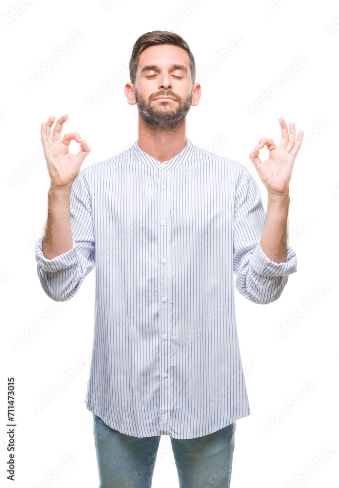 Young handsome man over isolated background relax and smiling with eyes closed doing meditation gesture with fingers. Yoga concept. Young handsome man over isolated background relax and smiling with eyes closed doing meditation gesture with fingers. Yoga concept.