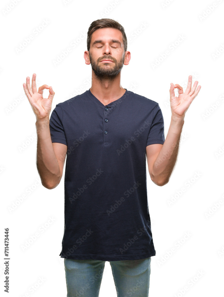 Young handsome man over isolated background relax and smiling with eyes closed doing meditation gesture with fingers. Yoga concept. Young handsome man over isolated background relax and smiling with eyes closed doing meditation gesture with fingers. Yoga concept.