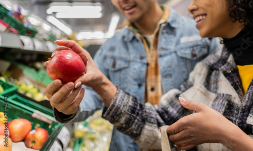 Картината върху платно close up young multiethnic people shopping at the supermarket coincide choosing