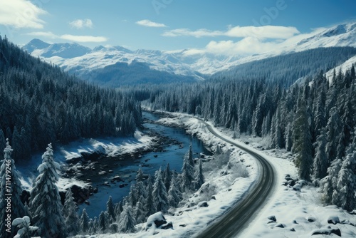 A winding road cuts through a snowy landscape, surrounded by towering trees and majestic mountains, as the freezing winter sky hangs heavy with clouds above the alpine scenery