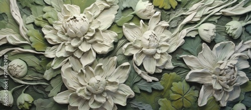 A relief sculpture of white chrysanthemum flowers with green foliage in a monochromatic palette.