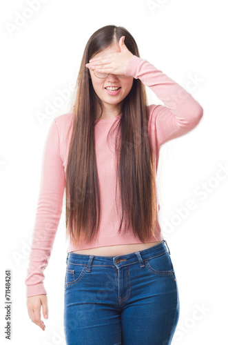 Young Chinese woman over isolated background wearing glasses smiling and laughing with hand on face covering eyes for surprise. Blind concept. © Krakenimages.com