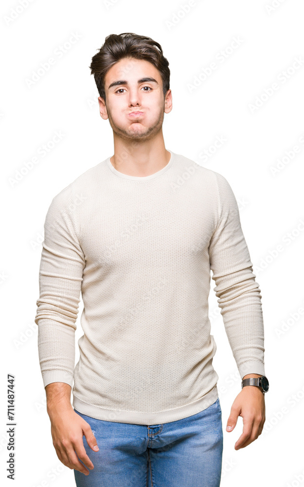 Young handsome man over isolated background puffing cheeks with funny face. Mouth inflated with air, crazy expression. Young handsome man over isolated background puffing cheeks with funny face. Mouth inflated with air, crazy expression.