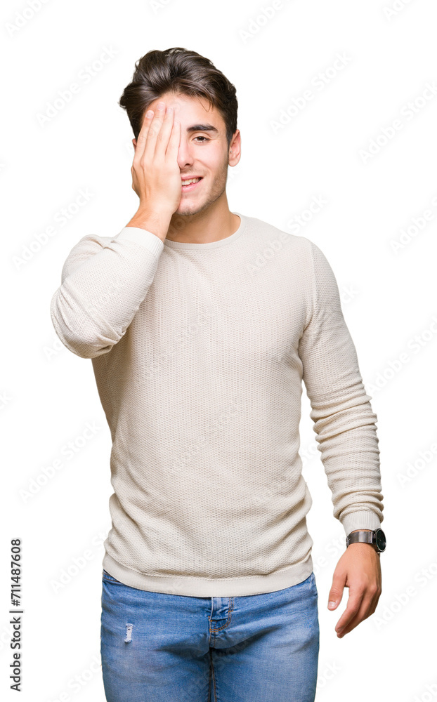 Young handsome man over isolated background covering one eye with hand with confident smile on face and surprise emotion. Young handsome man over isolated background covering one eye with hand with confident smile on face and surprise emotion.