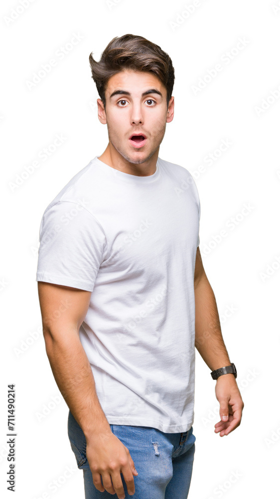 Young handsome man wearing white t-shirt over isolated background afraid and shocked with surprise expression, fear and excited face. Young handsome man wearing white t-shirt over isolated background afraid and shocked with surprise expression, fear and excited face.