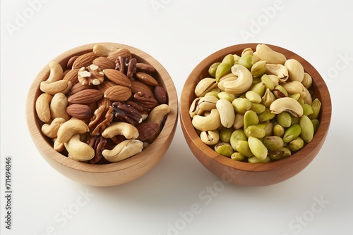 Assorted nuts in wooden bowl. Healthy snack with walnuts, pistachios, almonds, hazelnuts, cashews