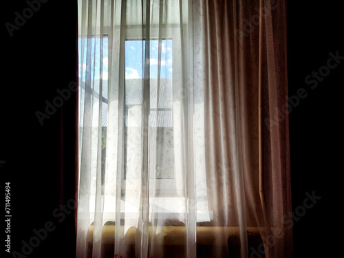 Window with dark curtains and tulle. Background  texture  pattern  place for text and copy space