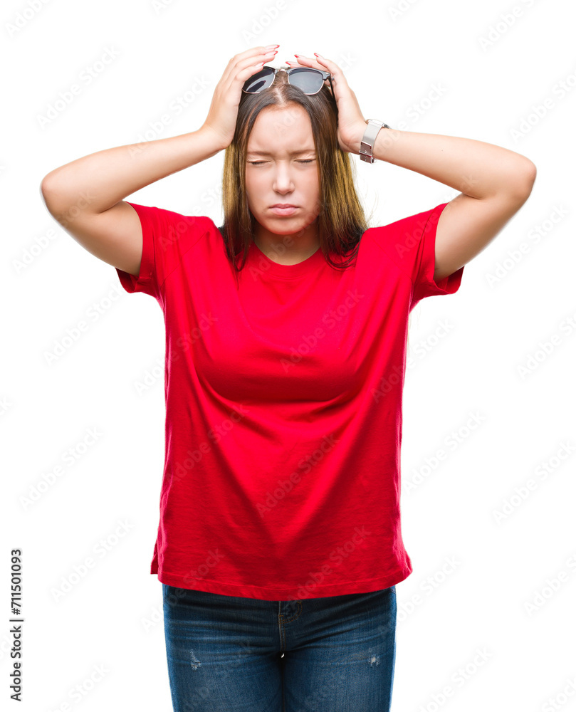 Young beautiful caucasian woman wearing sunglasses over isolated background suffering from headache desperate and stressed because pain and migraine. Hands on head. Young beautiful caucasian woman wearing sunglasses over isolated background suffering from headache desperate and stressed because pain and migraine. Hands on head.