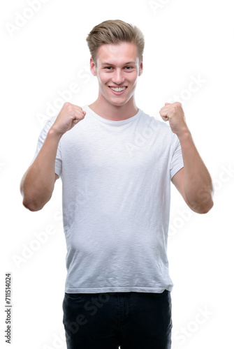 Young handsome blond man screaming proud and celebrating victory and success very excited, cheering emotion