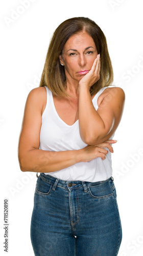 Beautiful middle age casual adult woman over isolated background thinking looking tired and bored with depression problems with crossed arms. © Krakenimages.com