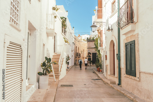 Couple walking the streets of Monopoli in Puglia, Italy  © LisaGageler