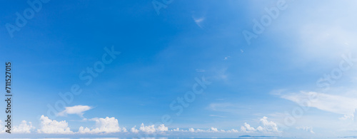 Panorama blue sky with white fluffy clouds