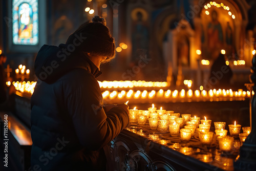 Individual lighting a candle in a church - offering prayers and thoughts for a departed soul - surrounded by a quiet and contemplative ambiance.