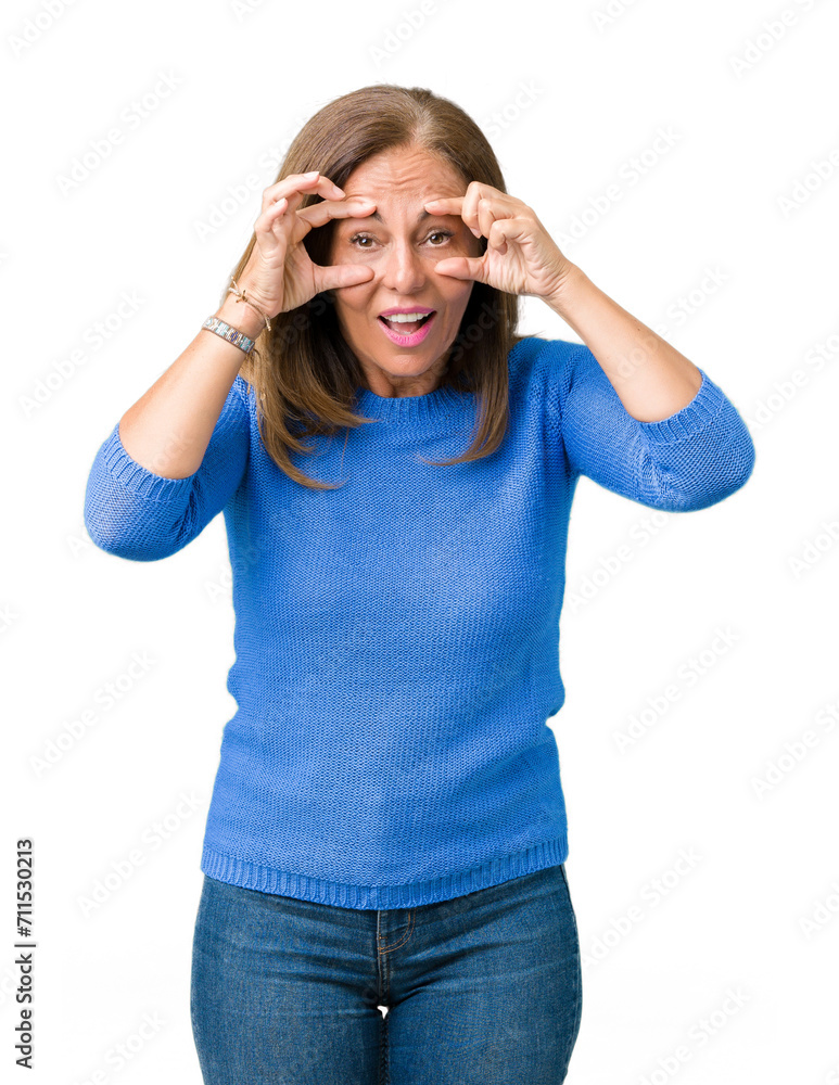 Middle age beautiful woman wearing winter sweater over isolated background Trying to open eyes with fingers, sleepy and tired for morning fatigue Middle age beautiful woman wearing winter sweater over isolated background Trying to open eyes with fingers, sleepy and tired for morning fatigue
