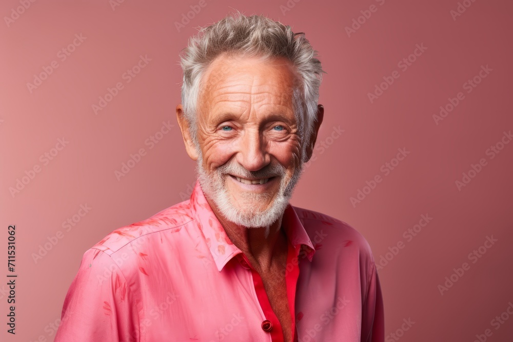 Portrait of a smiling senior man. Isolated on pink background. Portrait of a smiling senior man. Isolated on pink background.