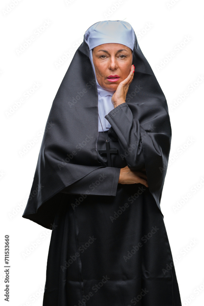 Middle age senior christian catholic nun woman over isolated background thinking looking tired and bored with depression problems with crossed arms.