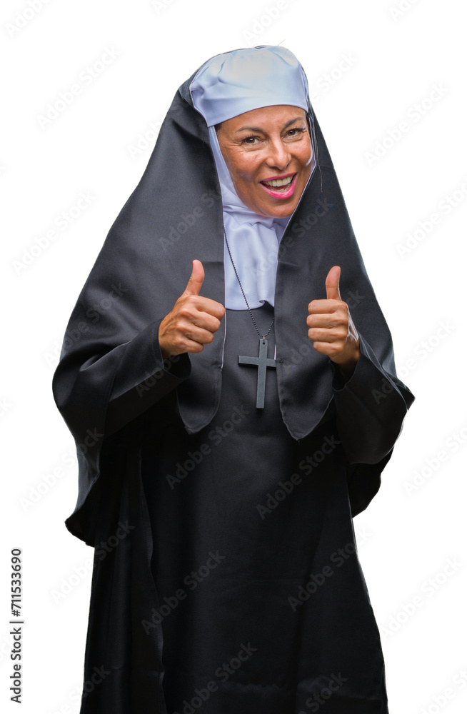 Middle age senior christian catholic nun woman over isolated background pointing fingers to camera with happy and funny face. Good energy and vibes. Middle age senior christian catholic nun woman over isolated background pointing fingers to camera with happy and funny face. Good energy and vibes.