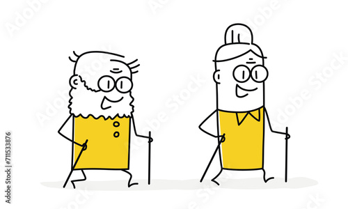 Active grandfather and grandmother nordic walking with sticks.