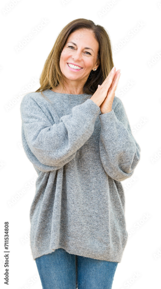 Beautiful middle age woman wearing winter sweater over isolated background Clapping and applauding happy and joyful, smiling proud hands together Beautiful middle age woman wearing winter sweater over isolated background Clapping and applauding happy and joyful, smiling proud hands together