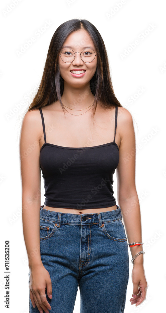 Obraz premium Young asian woman wearing glasses over isolated background with a happy and cool smile on face. Lucky person.