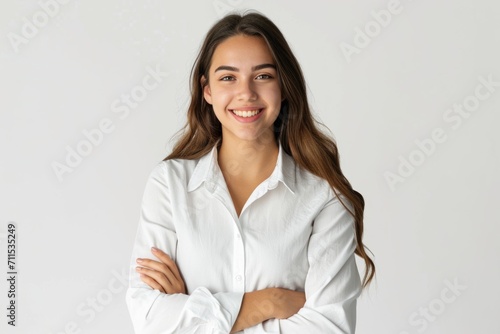 Confident brunette business woman student with folded arms.