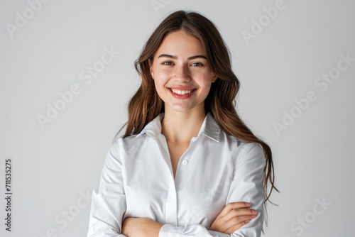 Confident brunette business woman student with folded arms.