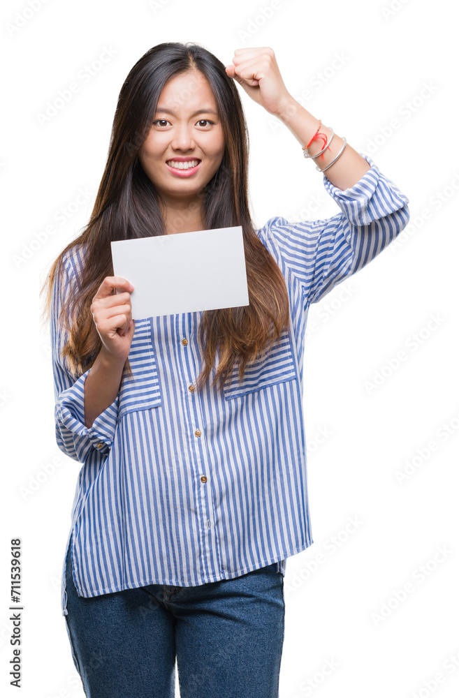 Young asian woman holding blank card over isolated background annoyed and frustrated shouting with anger, crazy and yelling with raised hand, anger concept Young asian woman holding blank card over isolated background annoyed and frustrated shouting with anger, crazy and yelling with raised hand, anger concept