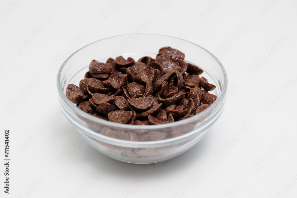 Choco cereals served in glass bowl on white Choco cereals served in glass bowl on white