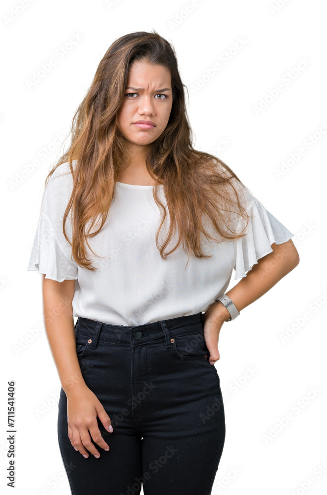 Young beautiful brunette business woman over isolated background skeptic and nervous, frowning upset because of problem. Negative person. Young beautiful brunette business woman over isolated background skeptic and nervous, frowning upset because of problem. Negative person.