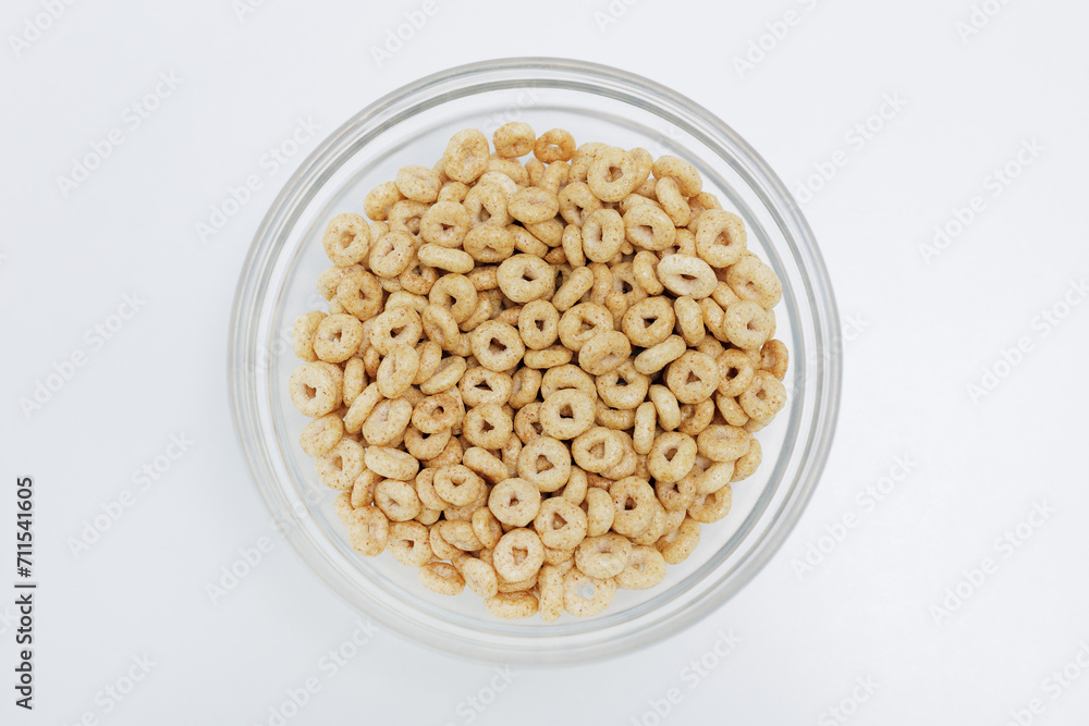 Top view of loops cereals served in bowl on white background