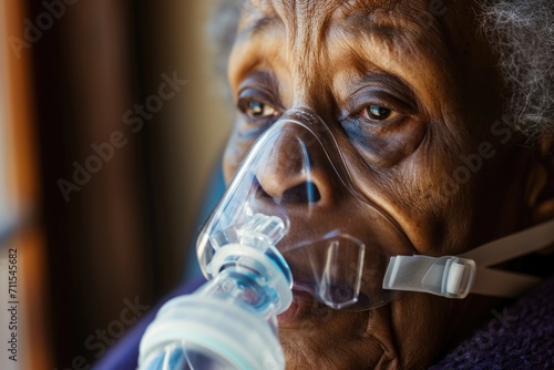 An elderly woman wearing an oxygen mask for medical purposes. This image can be used to depict healthcare, aging, or medical conditions