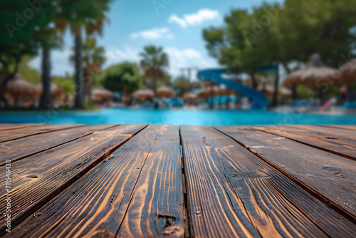 Empty Wooden Boardwalk Tabletop with Blurry water park Background, Aquatic Funland photo