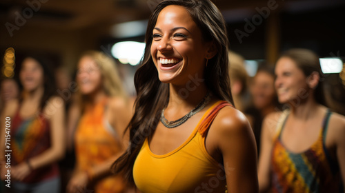 A girl in yellow smiles at a party.