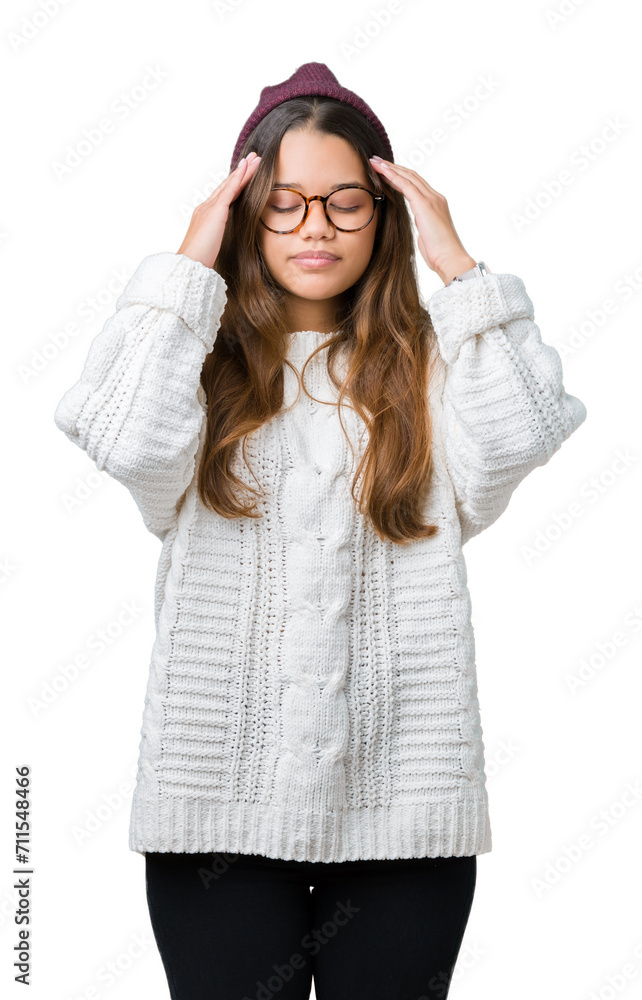 Young beautiful brunette hipster woman wearing glasses and winter hat over isolated background with hand on head for pain in head because stress. Suffering migraine. Young beautiful brunette hipster woman wearing glasses and winter hat over isolated background with hand on head for pain in head because stress. Suffering migraine.