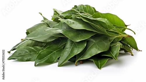 an isolated pile of whole bay leaves on a white background, capturing the herb's deep green color and aromatic leaves.