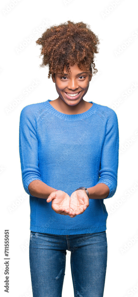 Beautiful young african american woman over isolated background Smiling with hands palms together receiving or giving gesture. Hold and protection Beautiful young african american woman over isolated background Smiling with hands palms together receiving or giving gesture. Hold and protection