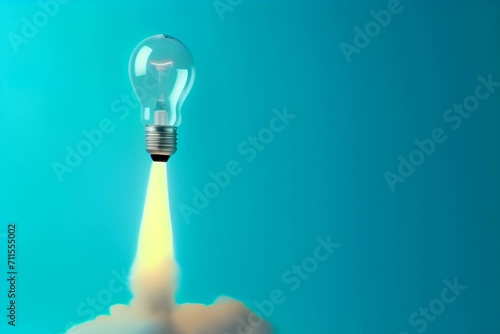 Light bulb taking off like rocket on blue background, startup and business concept.
