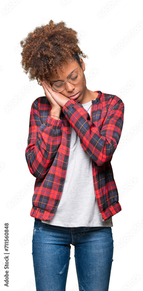 Beautiful young african american woman wearing glasses over isolated background sleeping tired dreaming and posing with hands together while smiling with closed eyes. Beautiful young african american woman wearing glasses over isolated background sleeping tired dreaming and posing with hands together while smiling with closed eyes.