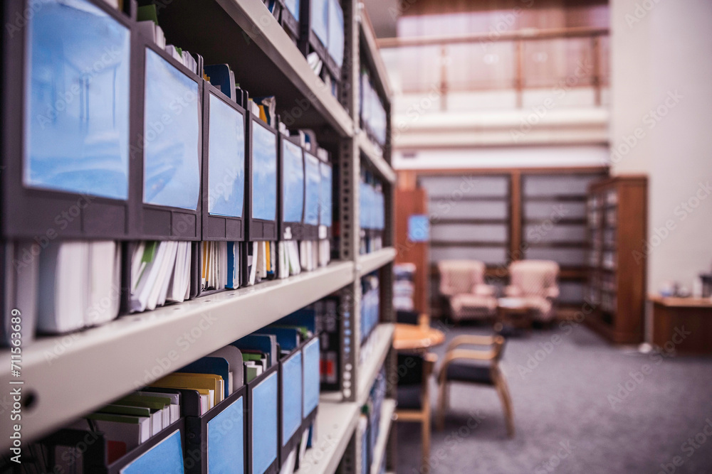 Shelves with binders and books in large start-up office space. Cape Town, South Africa Shelves with binders and books in large start-up office space. Cape Town, South Africa