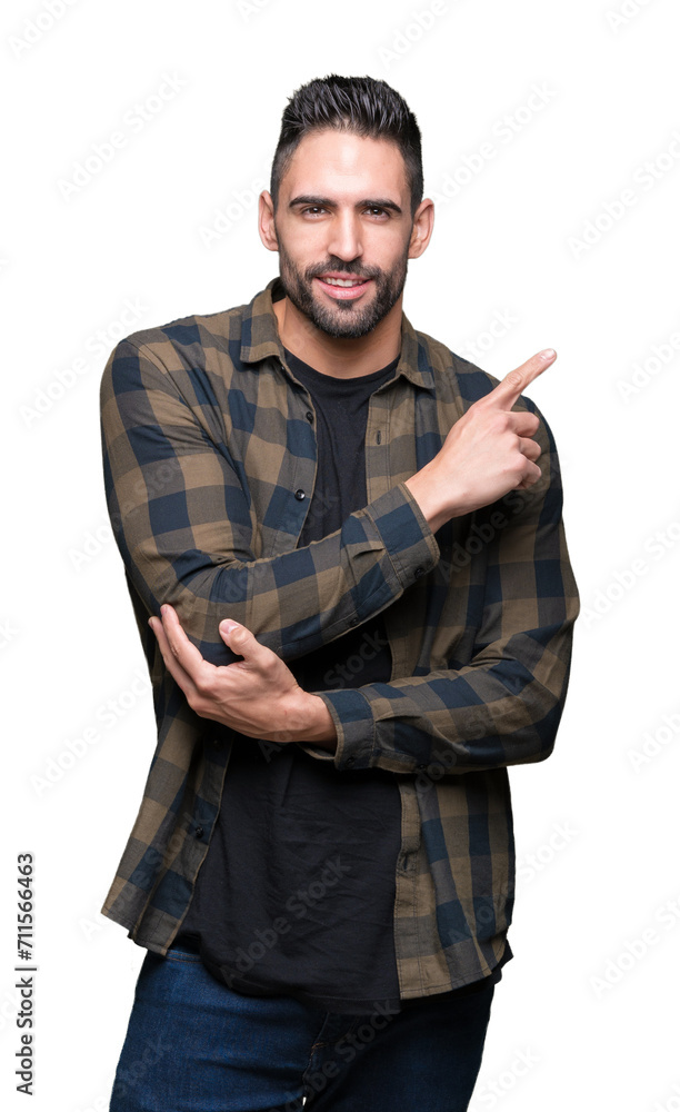 Young handsome man over isolated background with a big smile on face, pointing with hand and finger to the side looking at the camera. Young handsome man over isolated background with a big smile on face, pointing with hand and finger to the side looking at the camera.