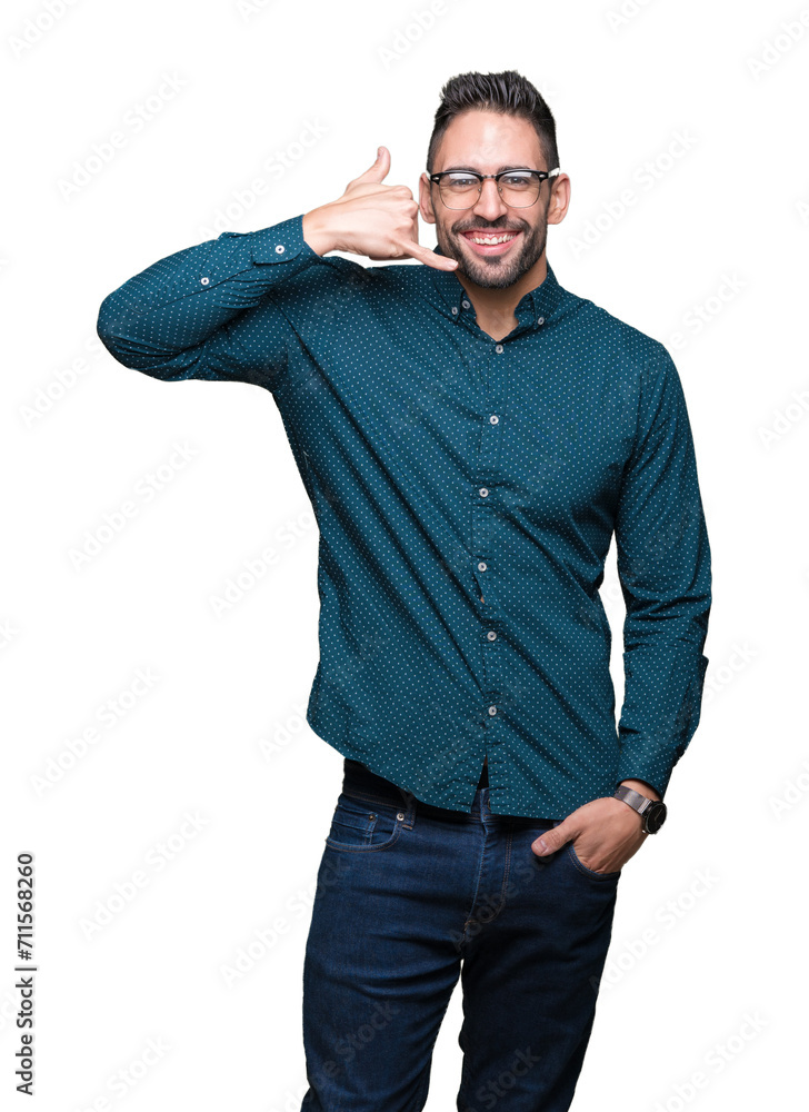 © Krakenimages.com - Young handsome business man wearing glasses over isolated background smiling doing phone gesture with hand and fingers like talking on the telephone. Communicating concepts. © Krakenimages.com - Young handsome business man wearing glasses over isolated background smiling doing phone gesture with hand and fingers like talking on the telephone. Communicating concepts.