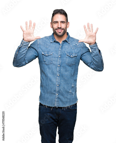 Young handsome man over isolated background showing and pointing up with fingers number ten while smiling confident and happy. © Krakenimages.com