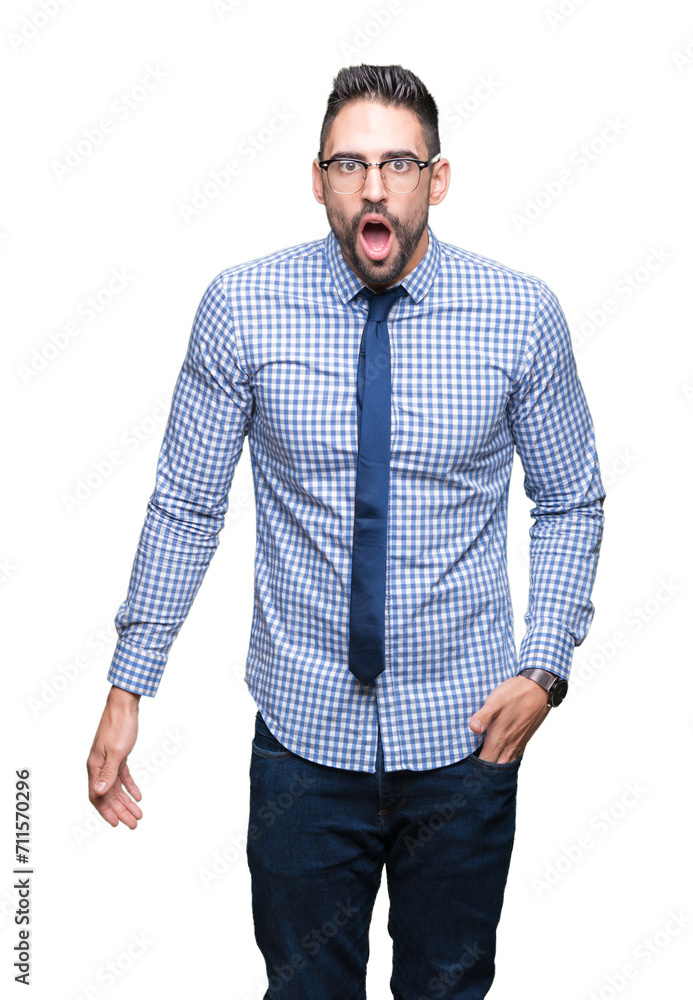 Young business man wearing glasses over isolated background In shock face, looking skeptical and sarcastic, surprised with open mouth Young business man wearing glasses over isolated background In shock face, looking skeptical and sarcastic, surprised with open mouth