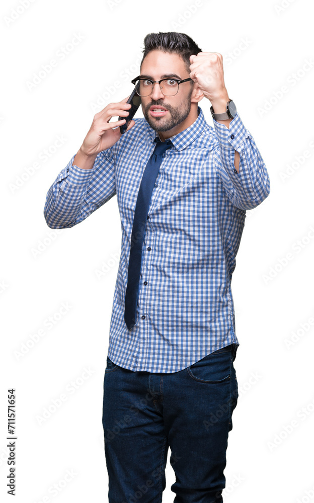 Young business man talking on the phone over isolated background annoyed and frustrated shouting with anger, crazy and yelling with raised hand, anger concept Young business man talking on the phone over isolated background annoyed and frustrated shouting with anger, crazy and yelling with raised hand, anger concept