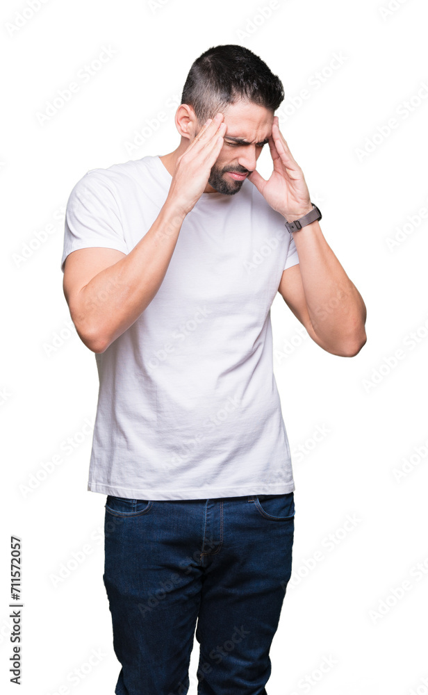 Young man wearing casual white t-shirt over isolated background with hand on head for pain in head because stress. Suffering migraine. Young man wearing casual white t-shirt over isolated background with hand on head for pain in head because stress. Suffering migraine.