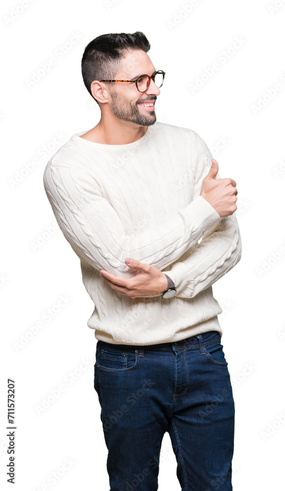 Fototapeta premium Young handsome man wearing glasses over isolated background Looking proud, smiling doing thumbs up gesture to the side
